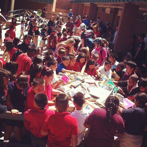 The kids at Frank Elementary were very excited to choose a free book delivered to them by volunteers on bikes.